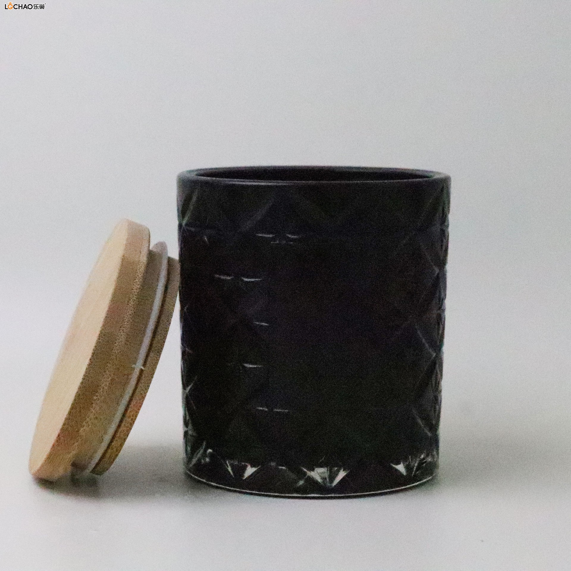 Embossed glass bottle scented candle