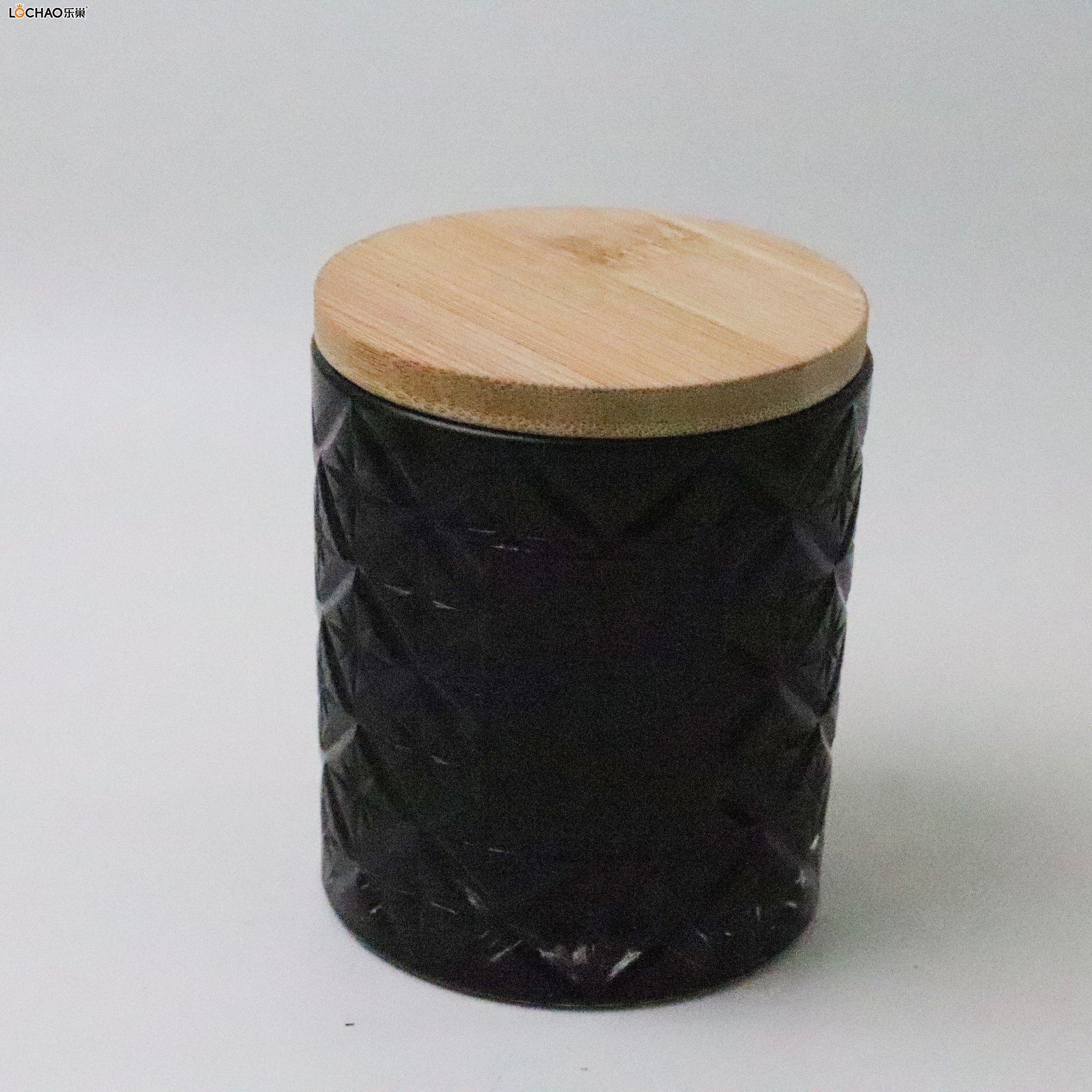 Embossed glass bottle scented candle